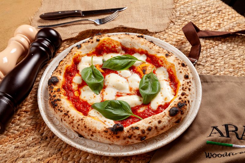 Margherita punch pizza with fresh mozzarella and basil