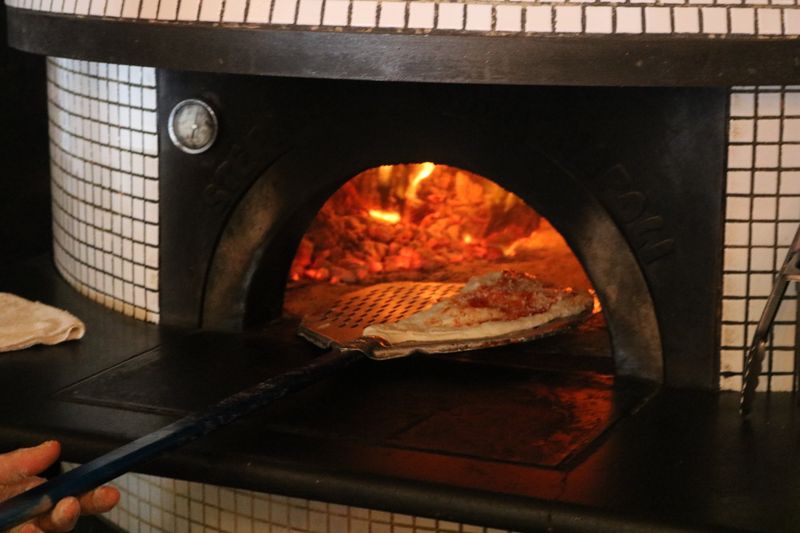 Authentic wood-fired oven at Punch pizza restaurant